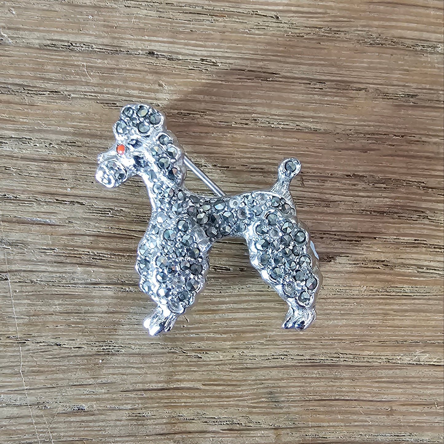 1950s silver-tone faux marcasite poodle dog brooch with rhinestone eye