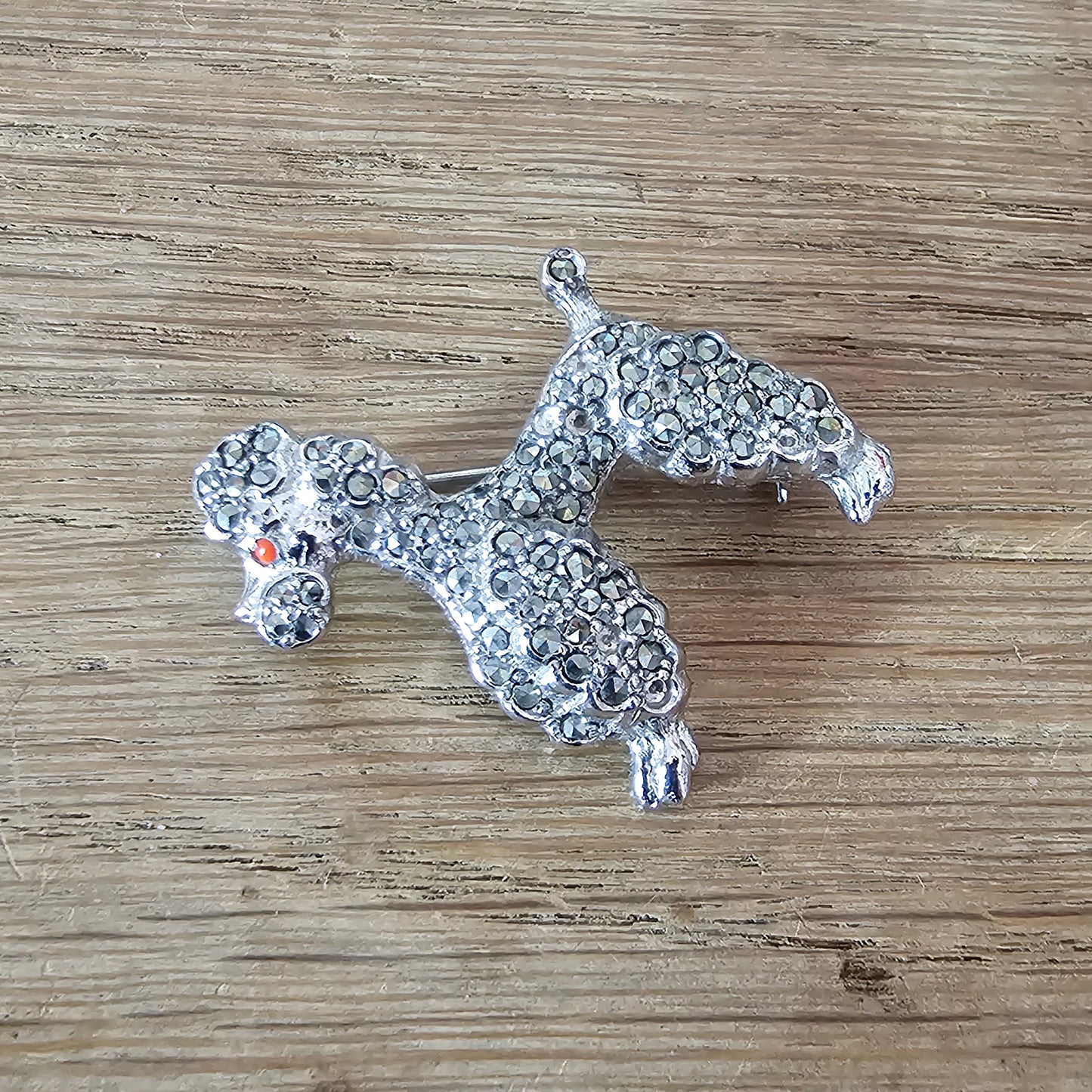 1950s silver-tone faux marcasite poodle dog brooch with rhinestone eye