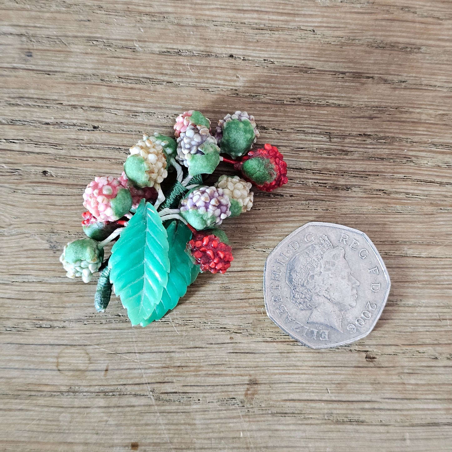 1930s/40s celluloid berry cluster brooch with moulded plastic leaves