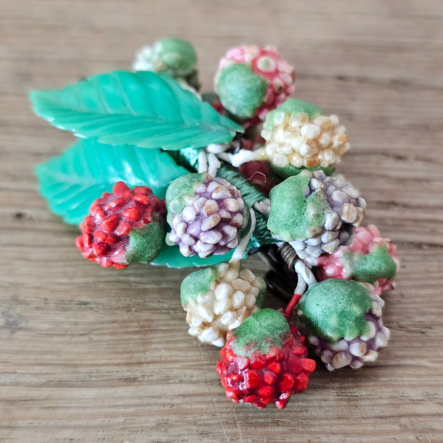 1930s/40s celluloid berry cluster brooch with moulded plastic leaves