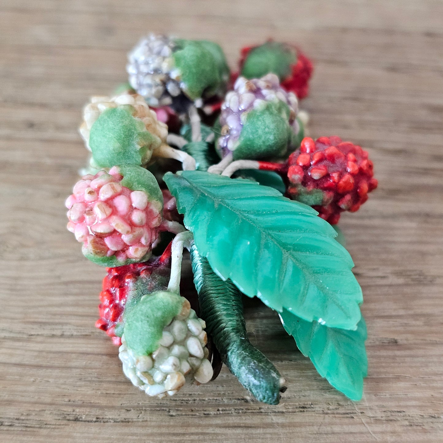 1930s/40s celluloid berry cluster brooch with moulded plastic leaves