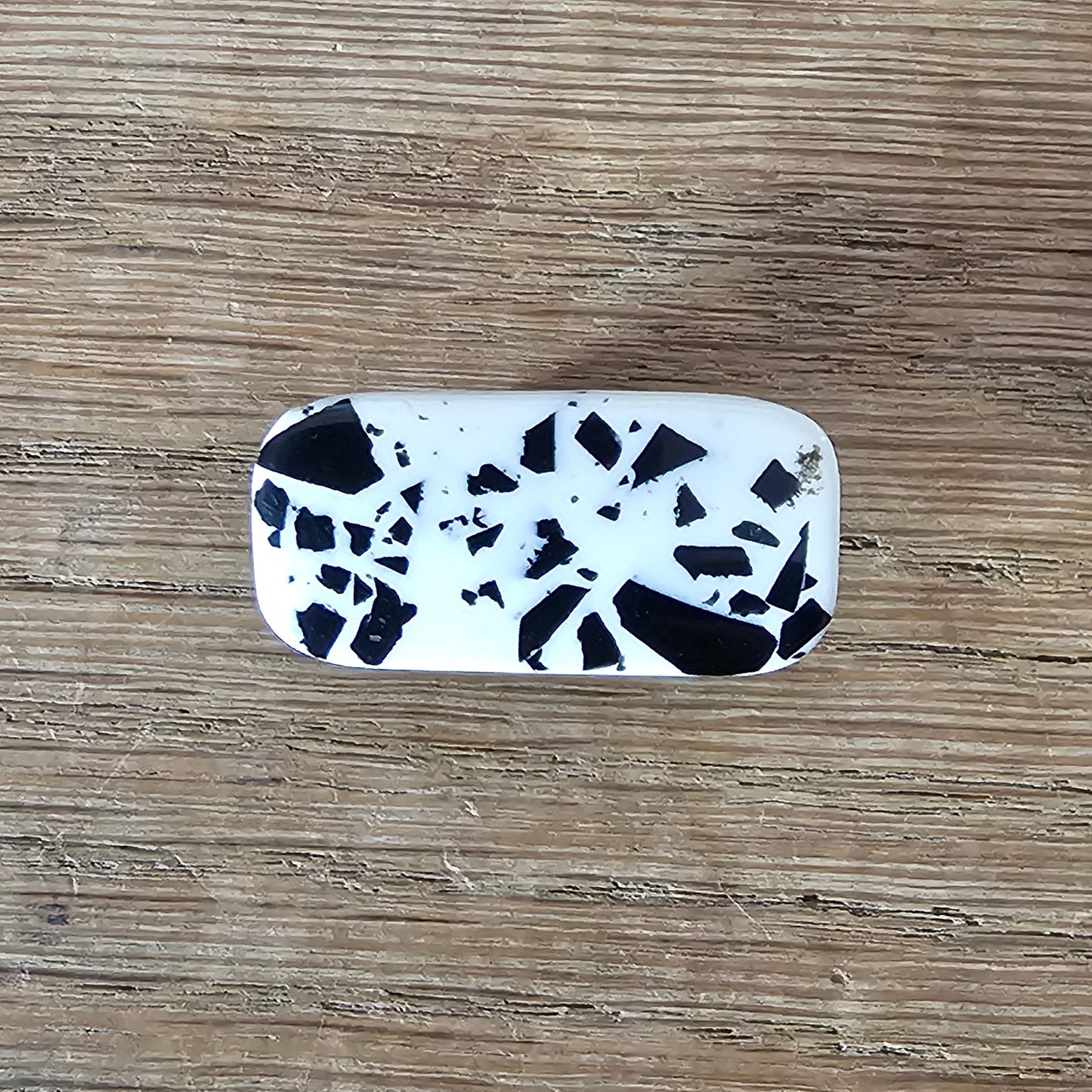 Home-made brooch using vintage black & white flecked plastic cabochon
