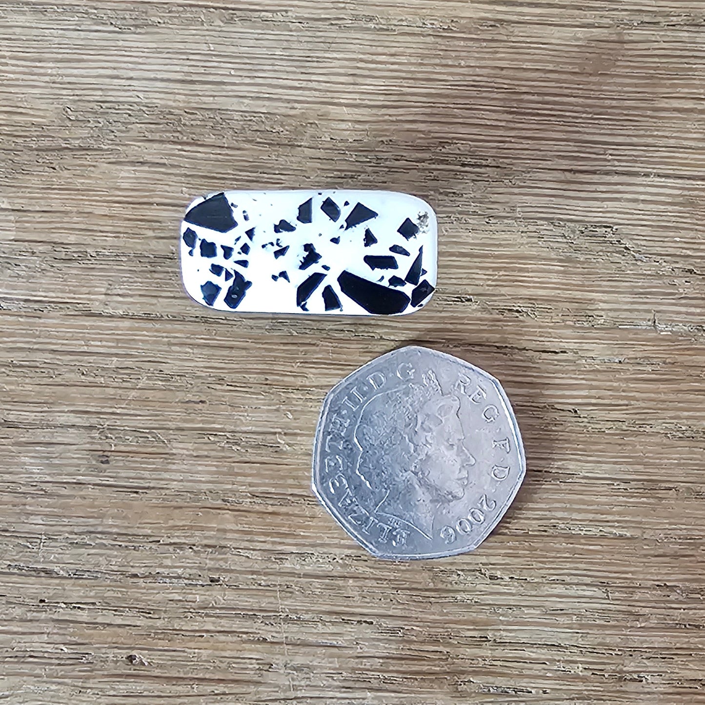 Home-made brooch using vintage black & white flecked plastic cabochon