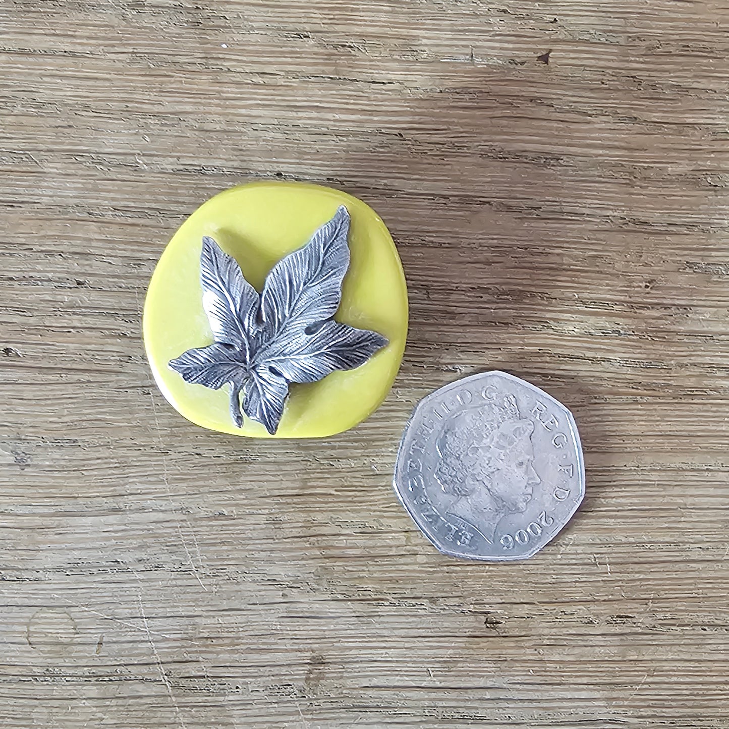 Home-made brooch using vintage silver-tone maple leaf & ochre-coloured flat bead
