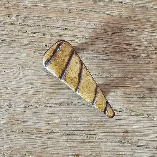 Home-made brooch using vintage carved wooden triangular bead