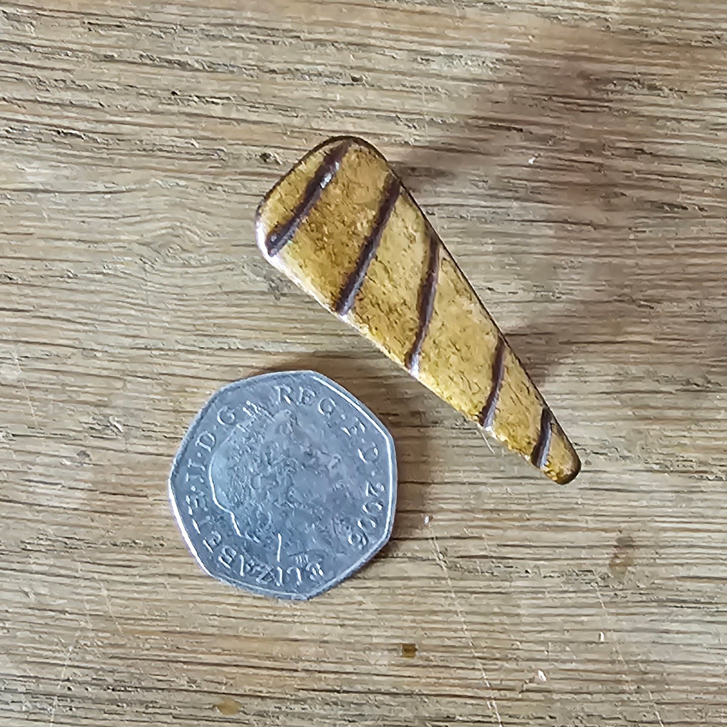 Home-made brooch using vintage carved wooden triangular bead