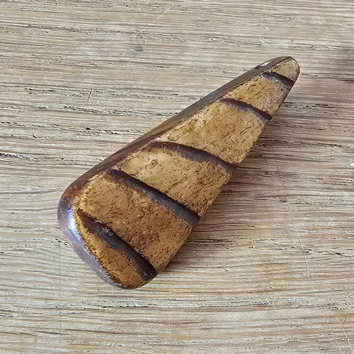 Home-made brooch using vintage carved wooden triangular bead