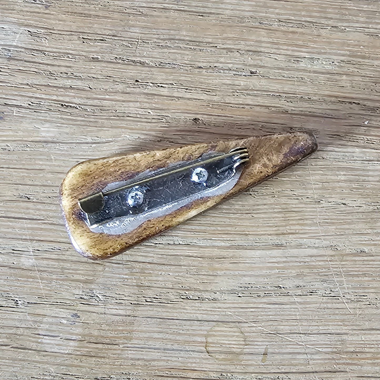Home-made brooch using vintage carved wooden triangular bead