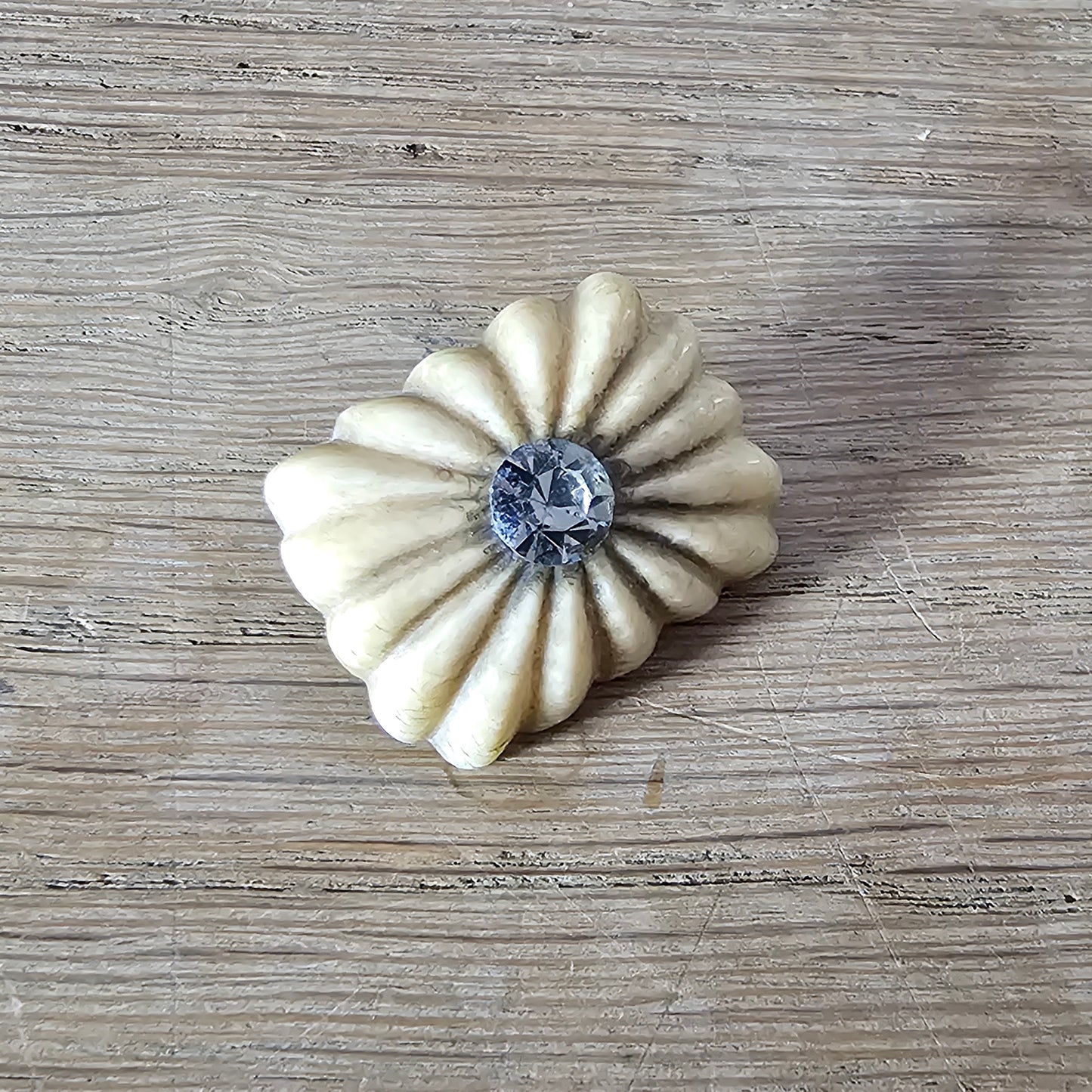 Home-made brooch using antique carved bone flower carving & rhinestone accent