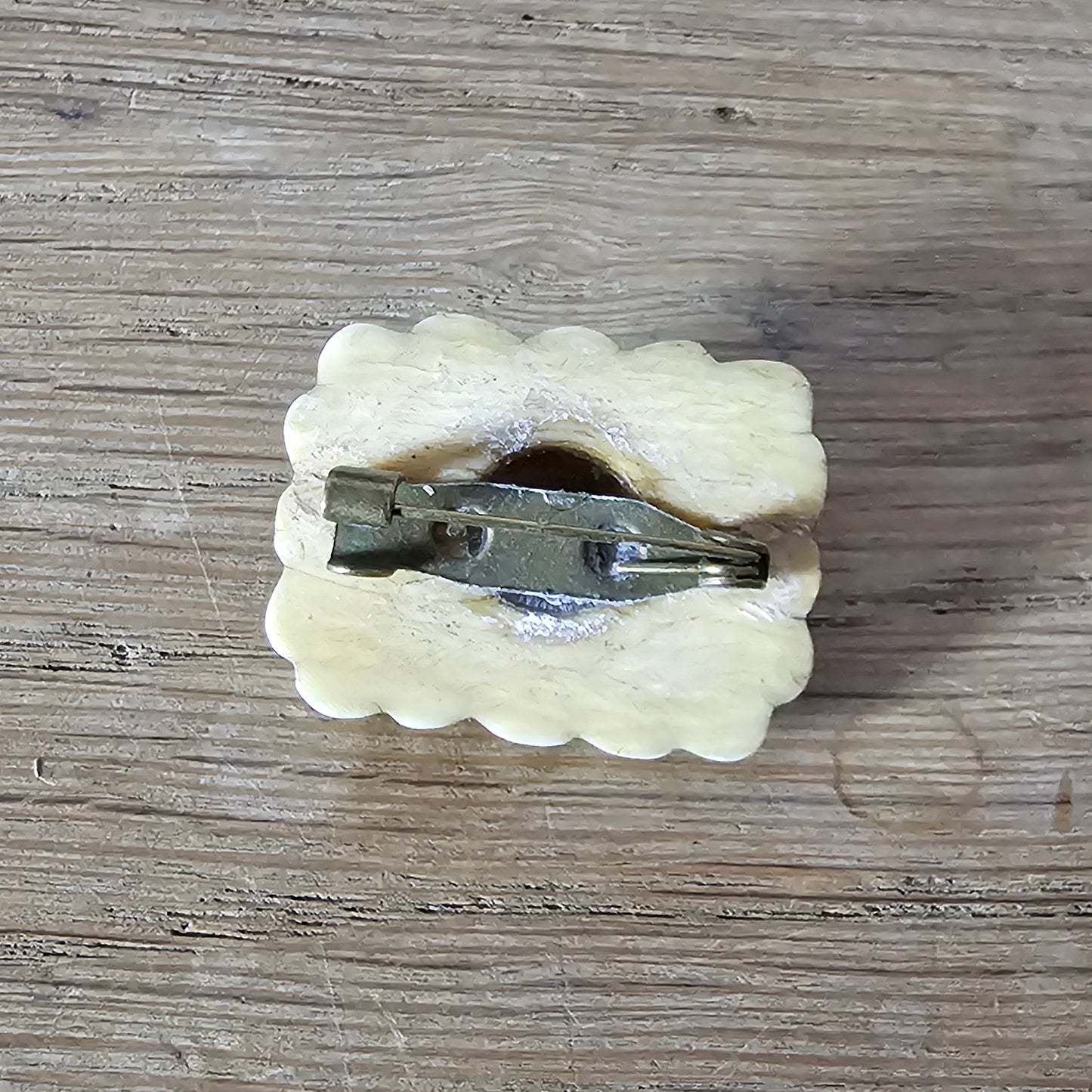 Home-made brooch using antique carved bone flower carving & rhinestone accent