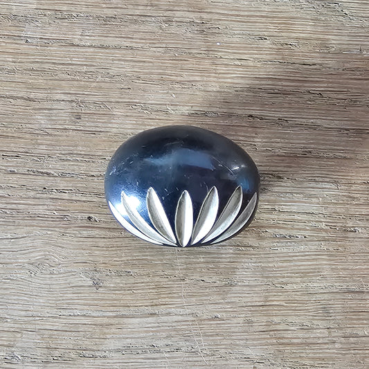 Home-made brooch using vintage carved bone sunburst cabochon