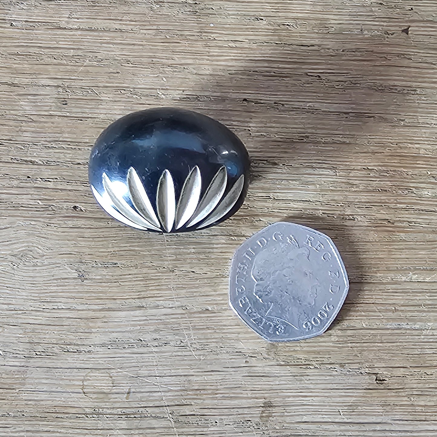 Home-made brooch using vintage carved bone sunburst cabochon