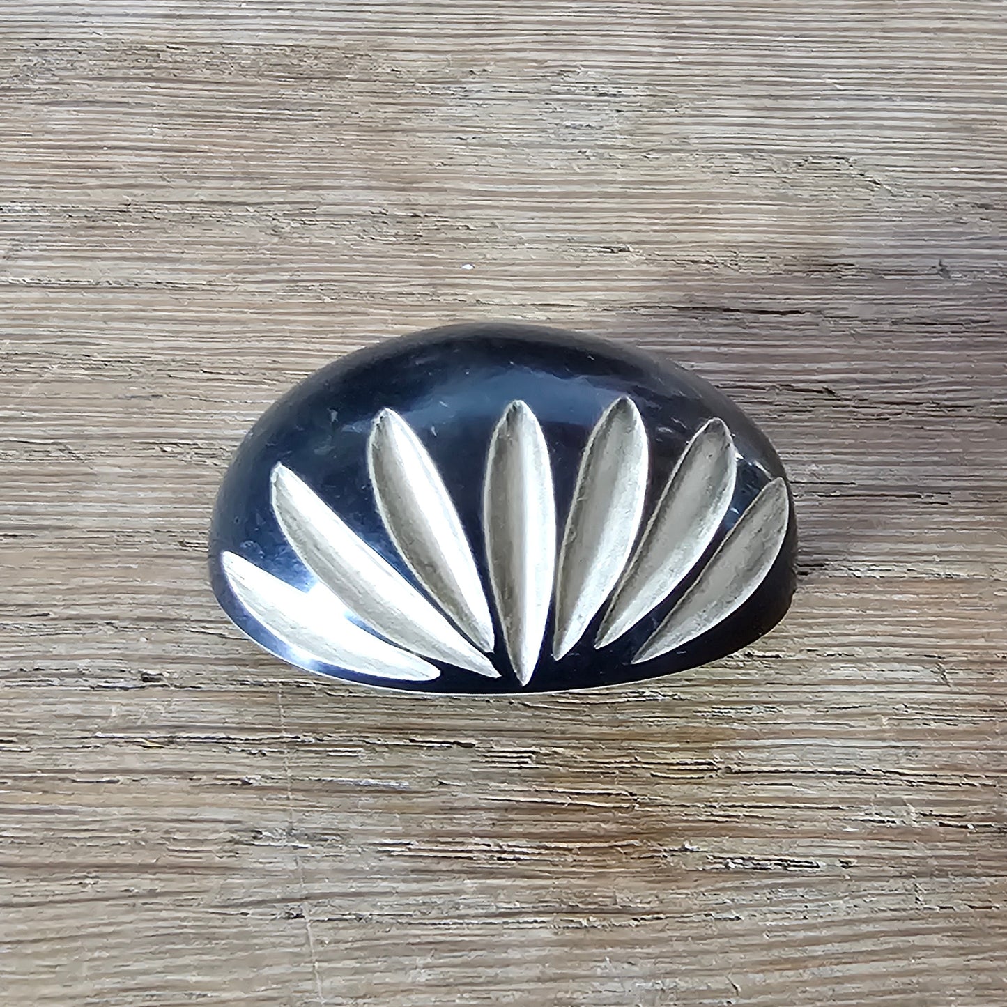 Home-made brooch using vintage carved bone sunburst cabochon
