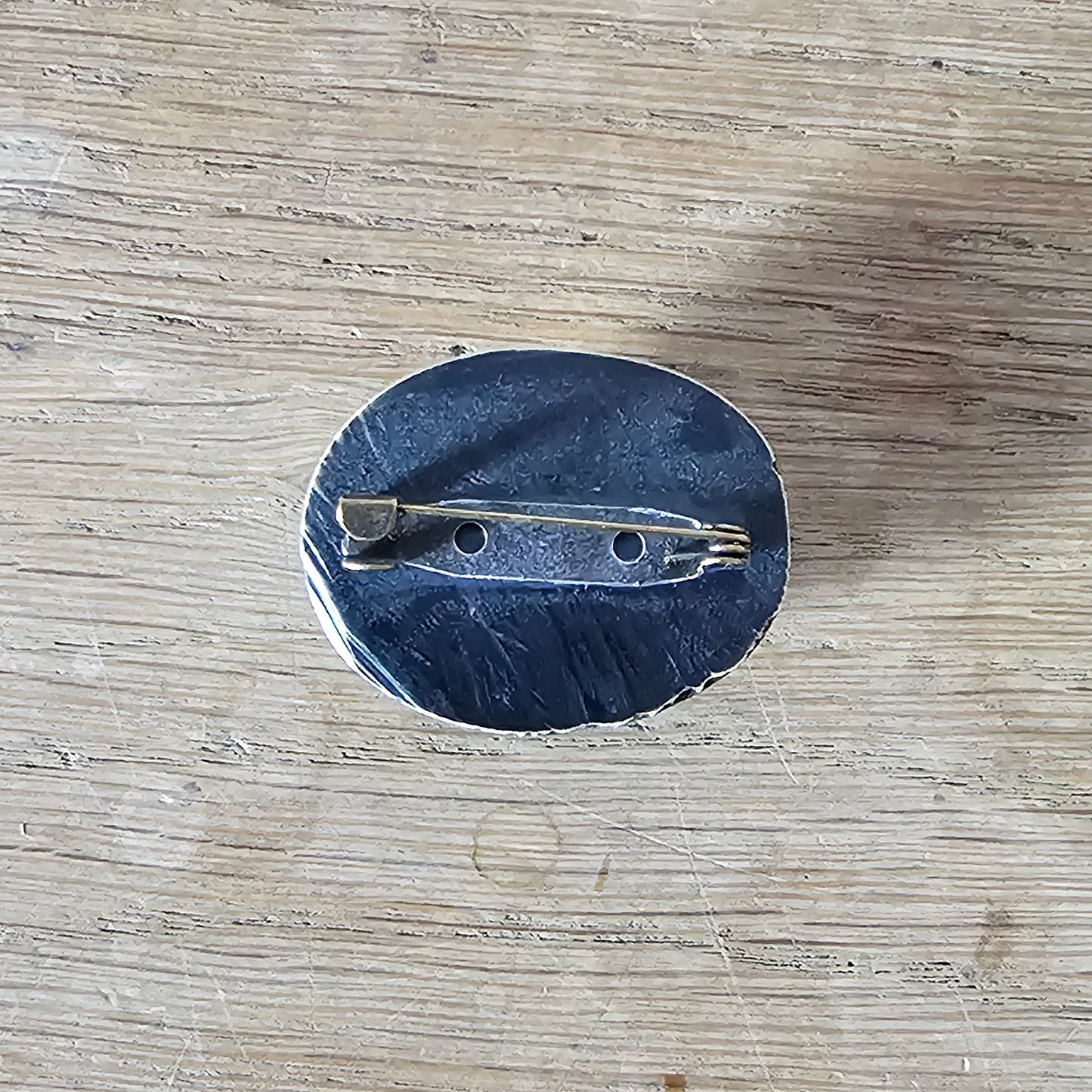 Home-made brooch using vintage carved bone sunburst cabochon