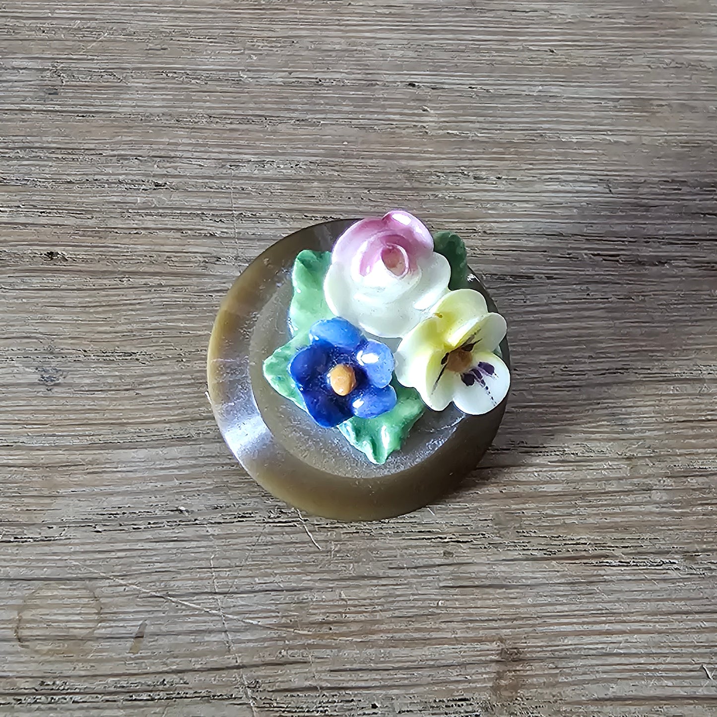 Home-made brooch using vintage china flowers and vintage button