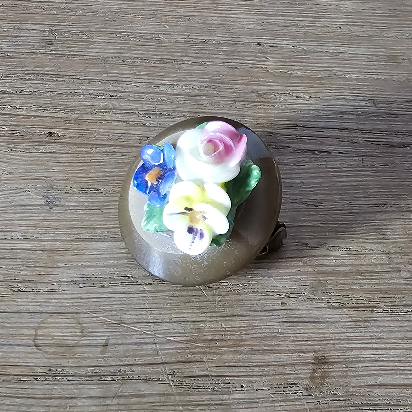 Home-made brooch using vintage china flowers and vintage button