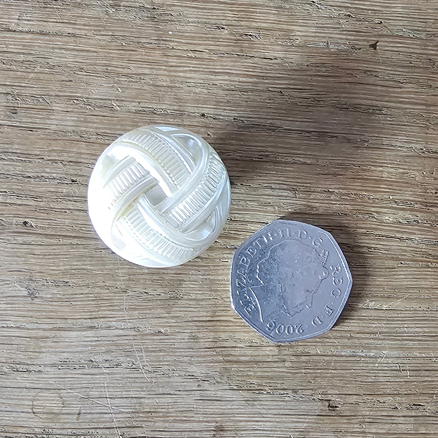 Home-made brooch using vintage plastic ivory coloured knot button