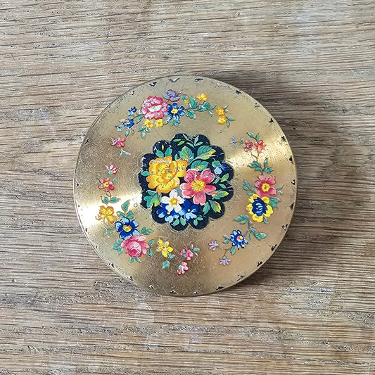 1950s gold-tone powder compact with floral transfer decoration