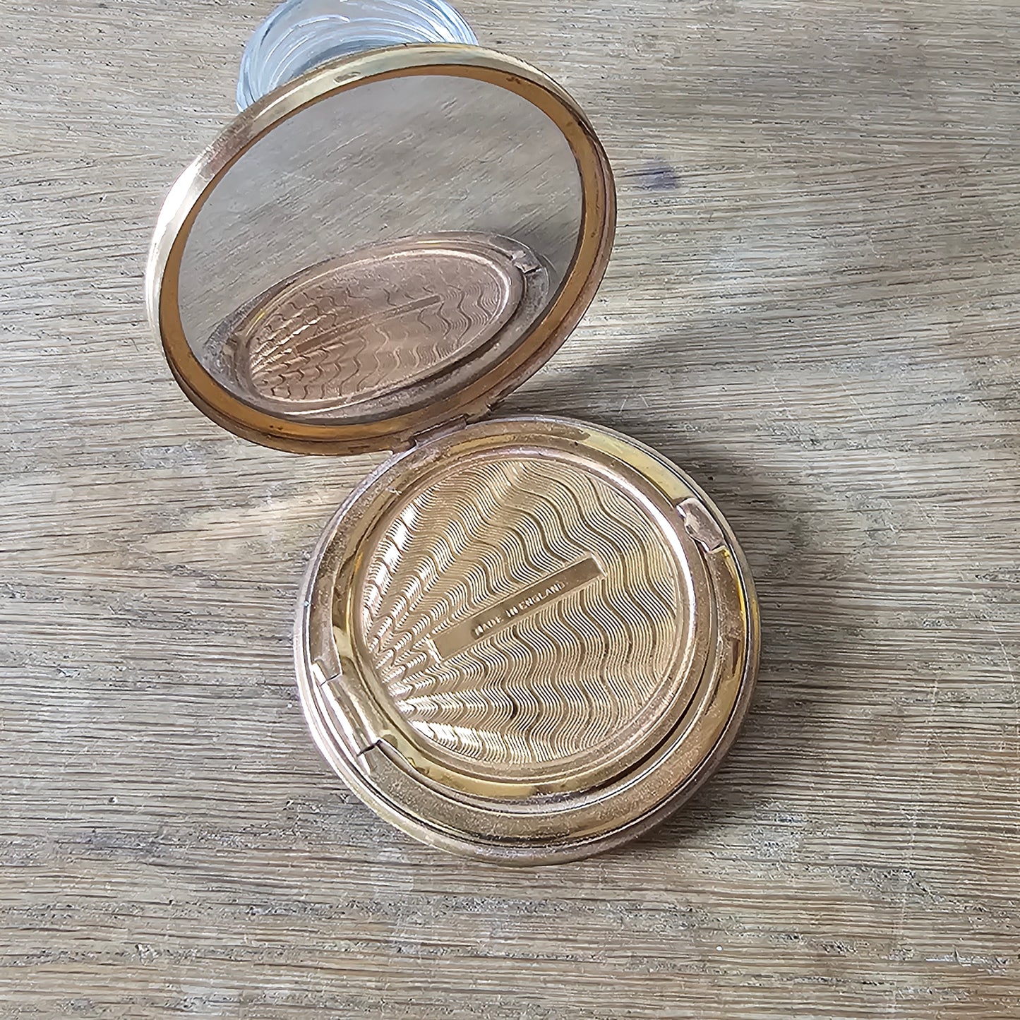 1950s gold-tone powder compact with floral transfer decoration