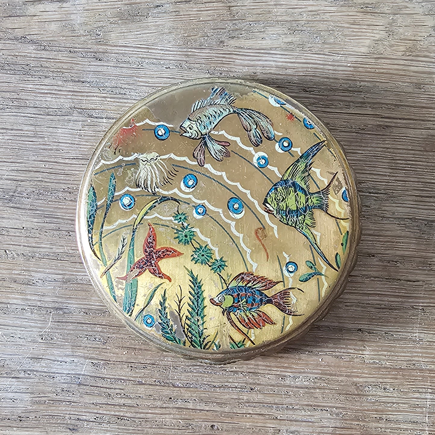 1950s gilt powder compact with tropical fish design