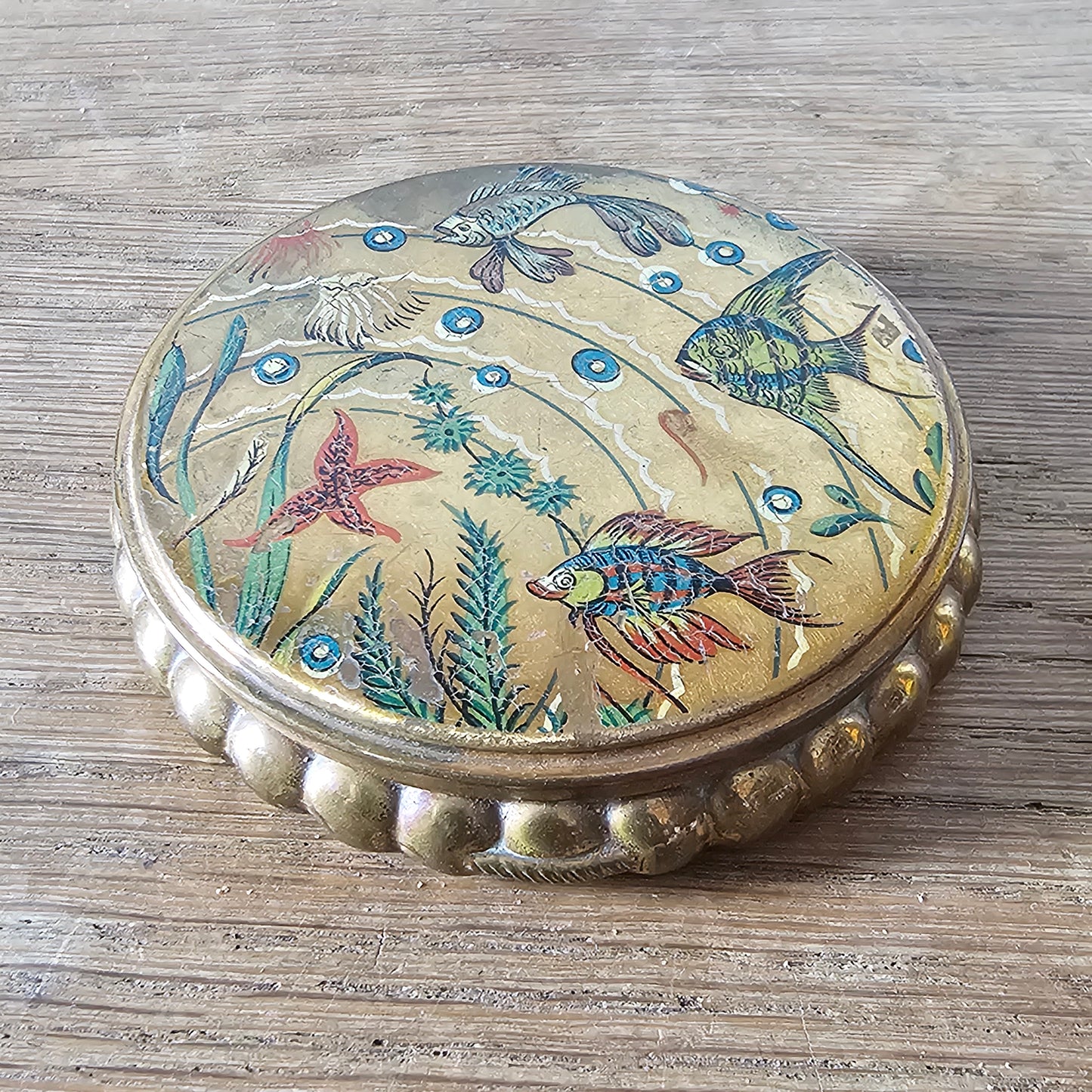 1950s gilt powder compact with tropical fish design