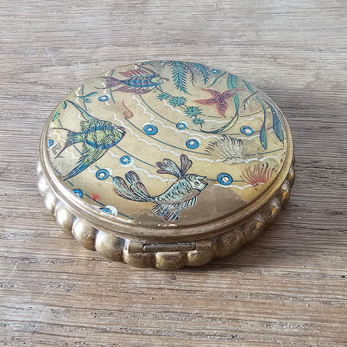 1950s gilt powder compact with tropical fish design