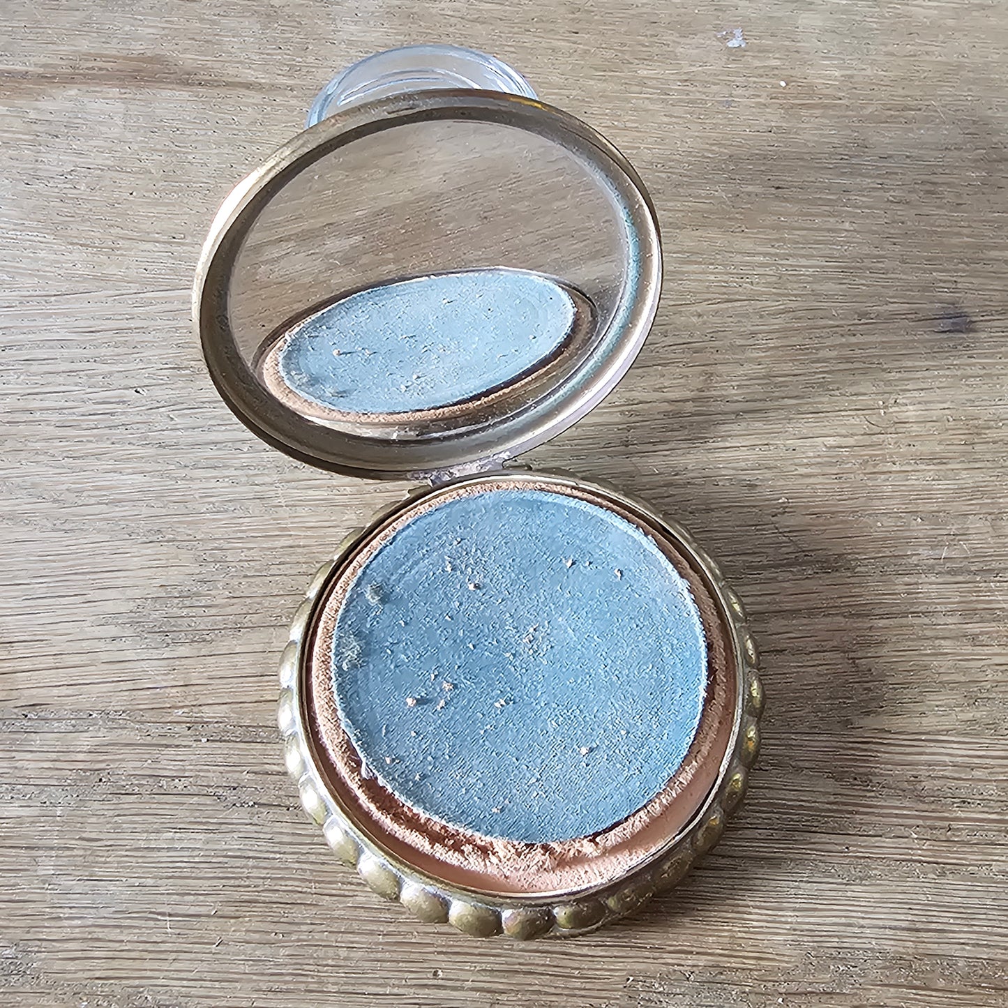 1950s gilt powder compact with tropical fish design