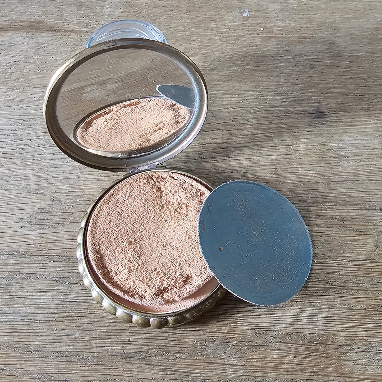 1950s gilt powder compact with tropical fish design