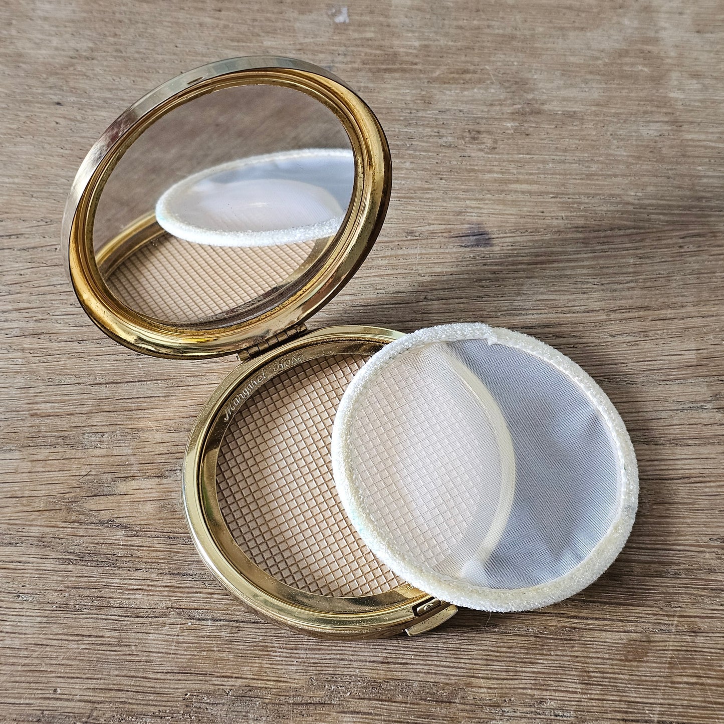 1950s Margaret Rose gold-tone powder compact with engraved starburst design