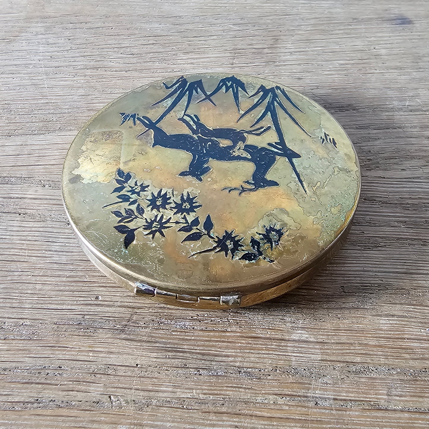 1950s gold-tone powder compact with deer silhouette design