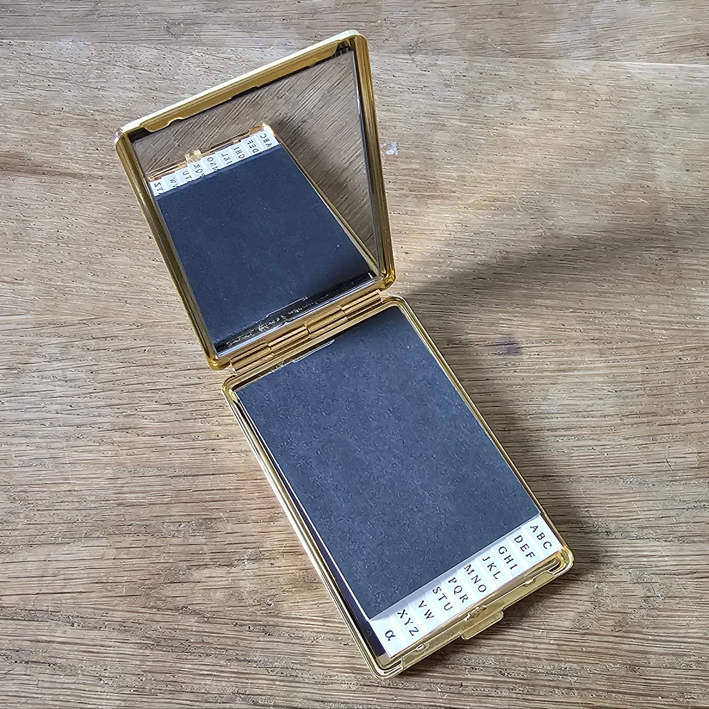 1960/70s gold-tone mirrored address book compact