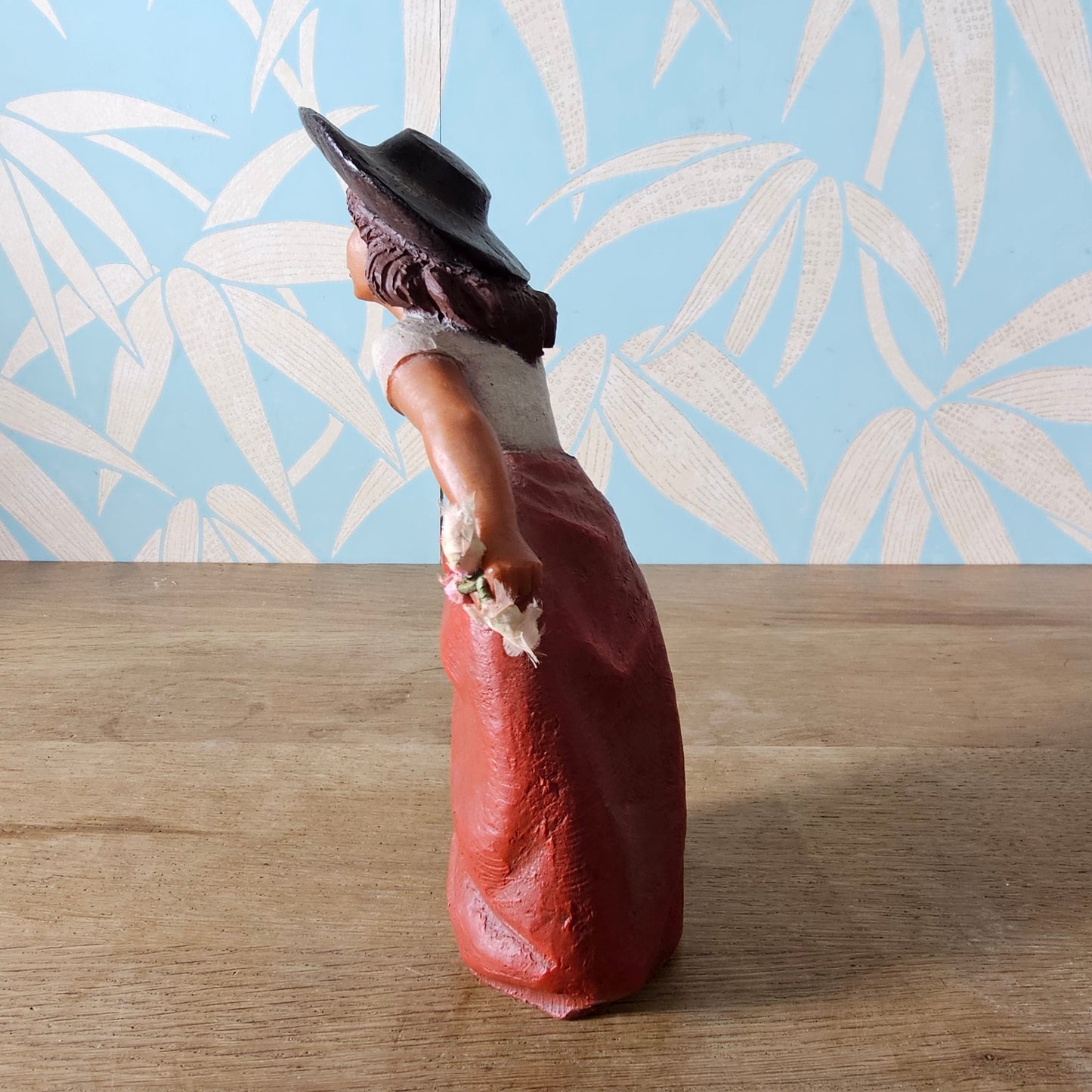 1990s signed sculpted resin country girl figurine leaning into the wind
