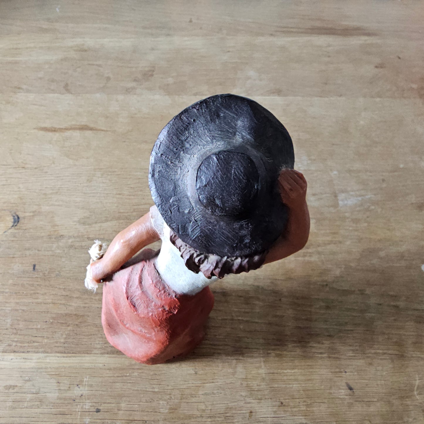 1990s signed sculpted resin country girl figurine leaning into the wind