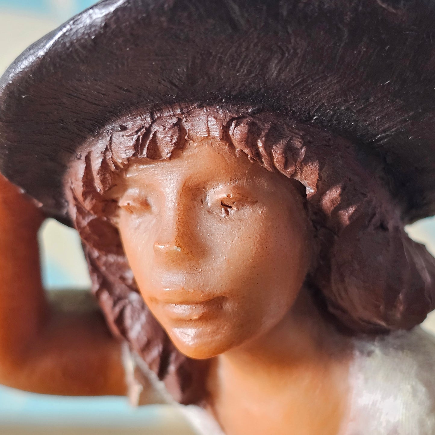1990s signed sculpted resin country girl figurine leaning into the wind
