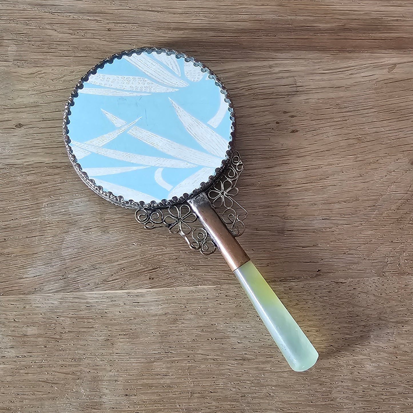 Art Deco hand-painted porcelain vanity mirror with serpentine handle