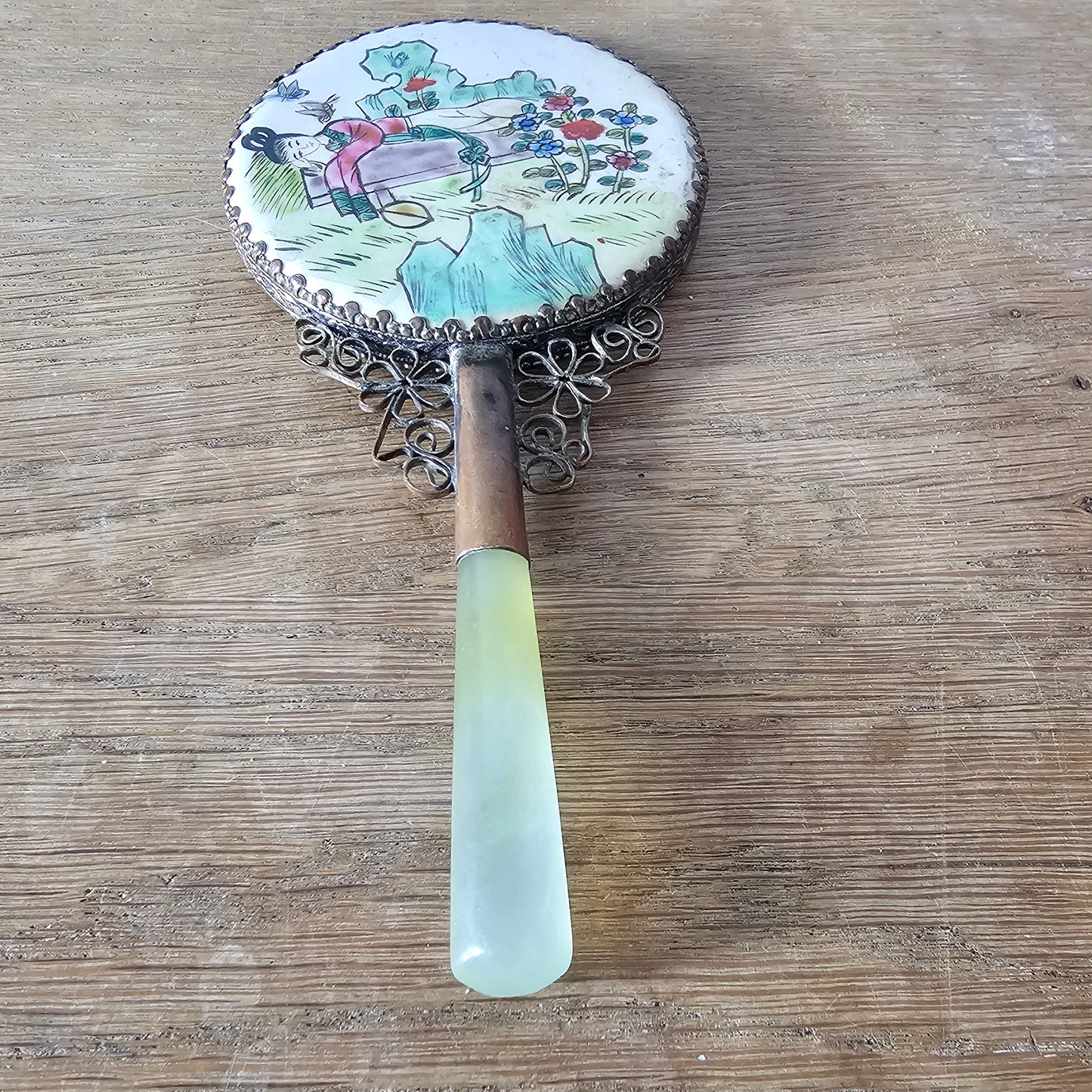 Art Deco hand-painted porcelain vanity mirror with serpentine handle