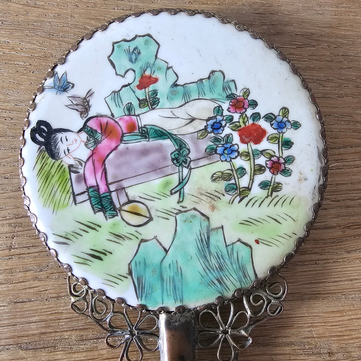 Art Deco hand-painted porcelain vanity mirror with serpentine handle