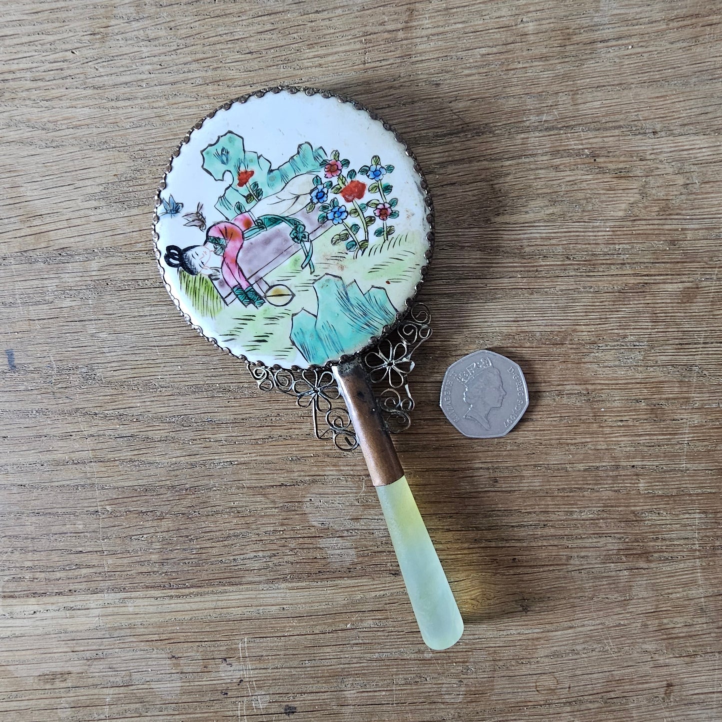 Art Deco hand-painted porcelain vanity mirror with serpentine handle