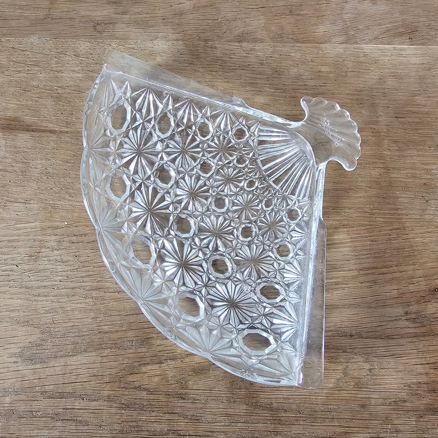 1970s Avon pressed glass fan-shaped trinket dish with starburst pattern