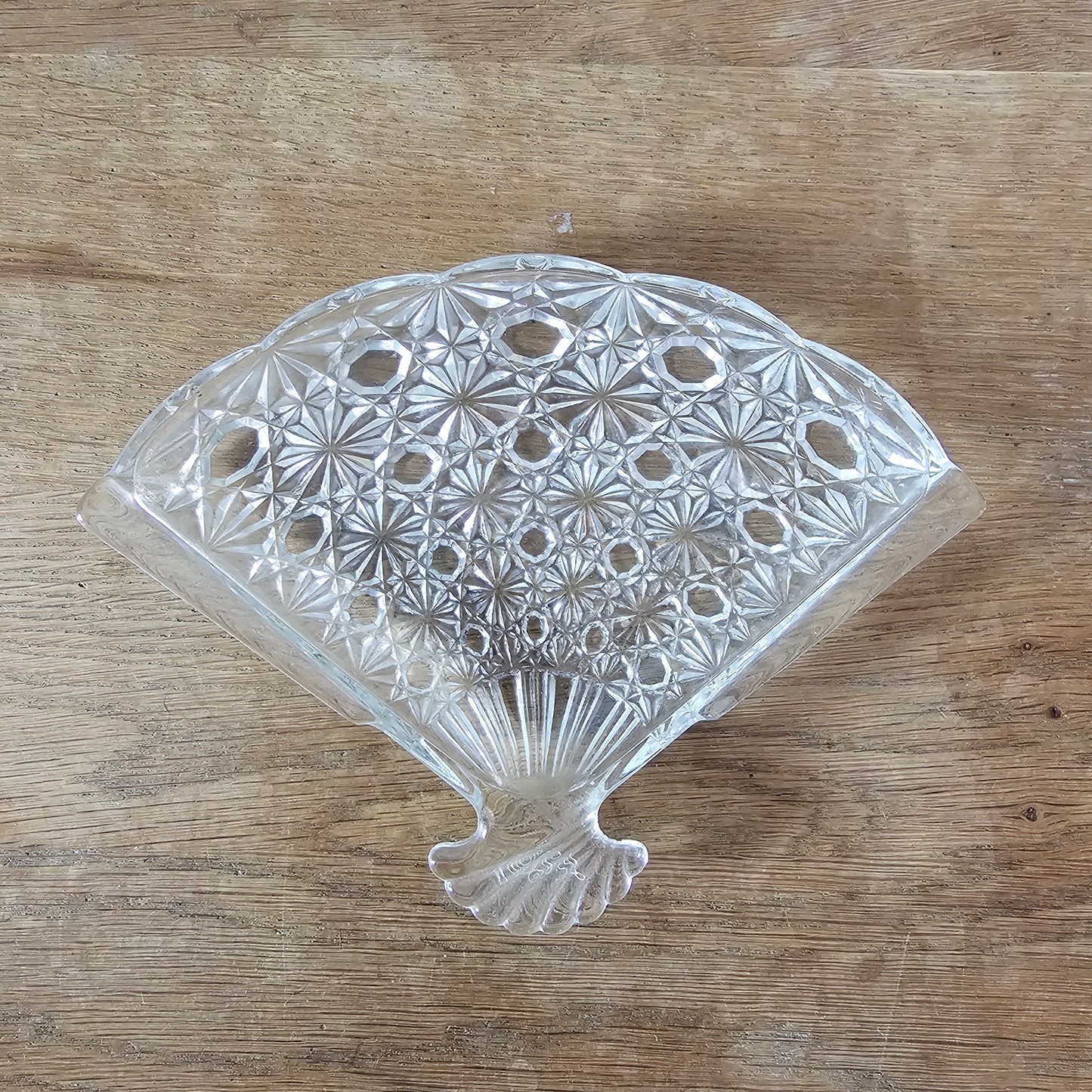 1970s Avon pressed glass fan-shaped trinket dish with starburst pattern