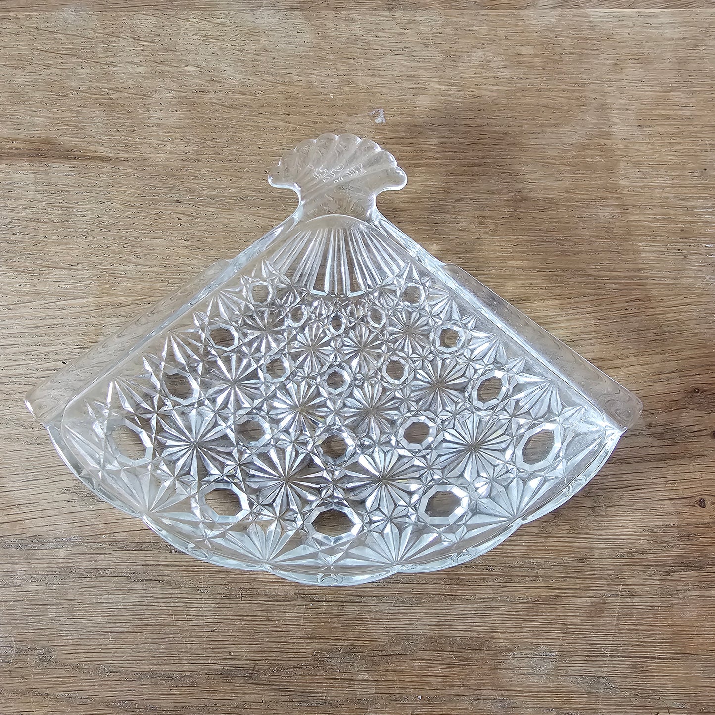 1970s Avon pressed glass fan-shaped trinket dish with starburst pattern