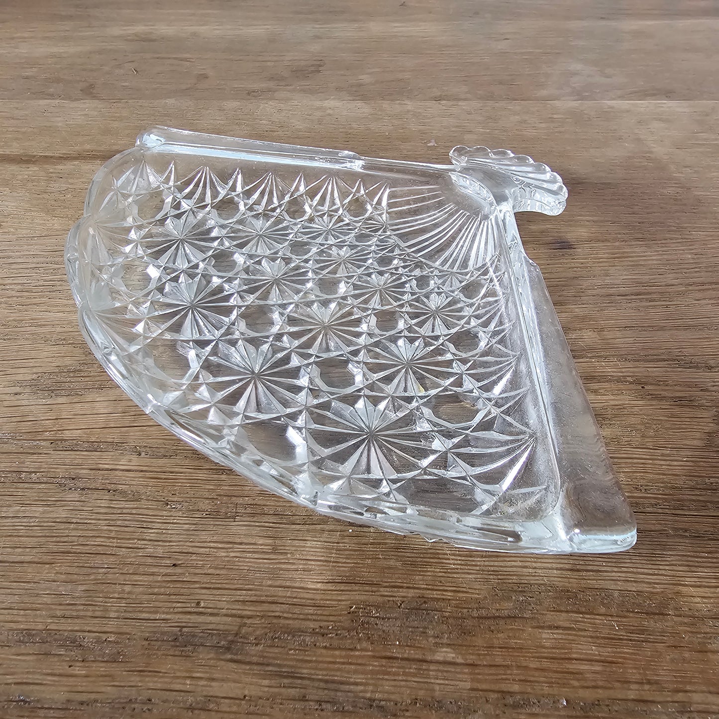 1970s Avon pressed glass fan-shaped trinket dish with starburst pattern