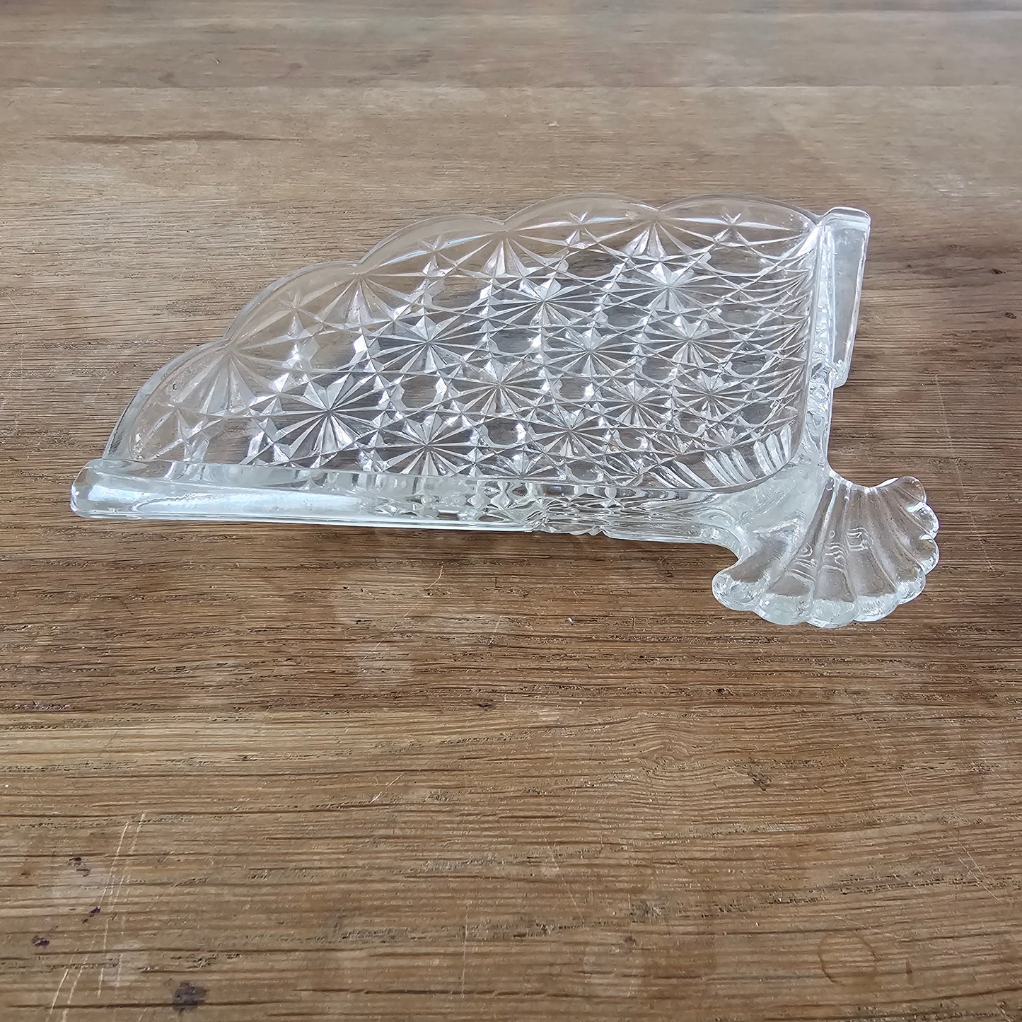 1970s Avon pressed glass fan-shaped trinket dish with starburst pattern