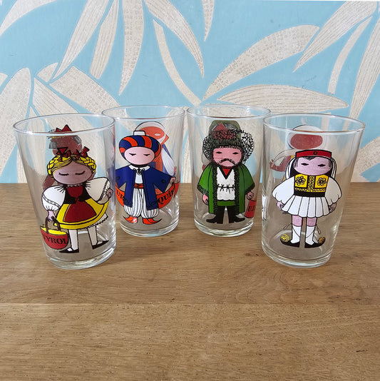 Set of four 1960s Saint-Gobain “World Doll” character tumblers with original box