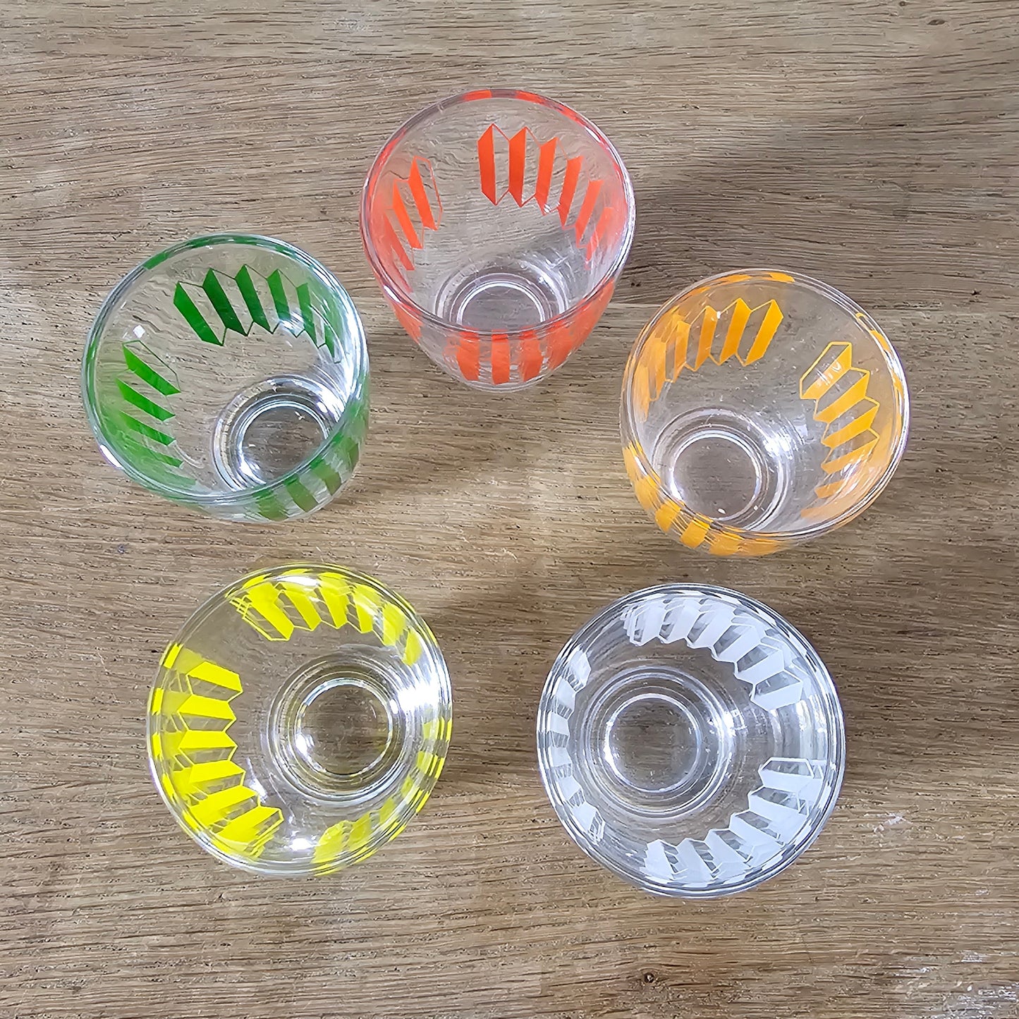 Set of five 1960s multicoloured geometric pattern shot glasses