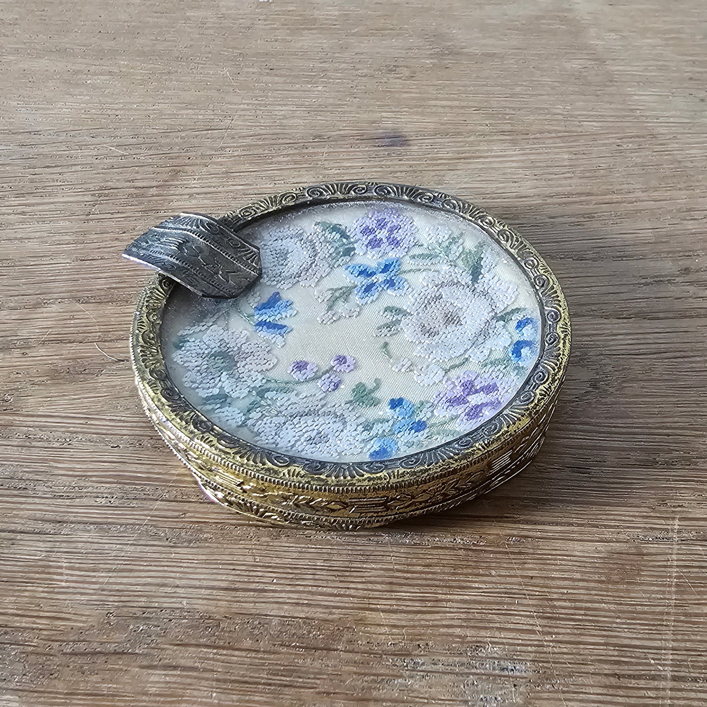 Vintage gilt metal and glass ladies’ ashtray with petit point floral embroidery