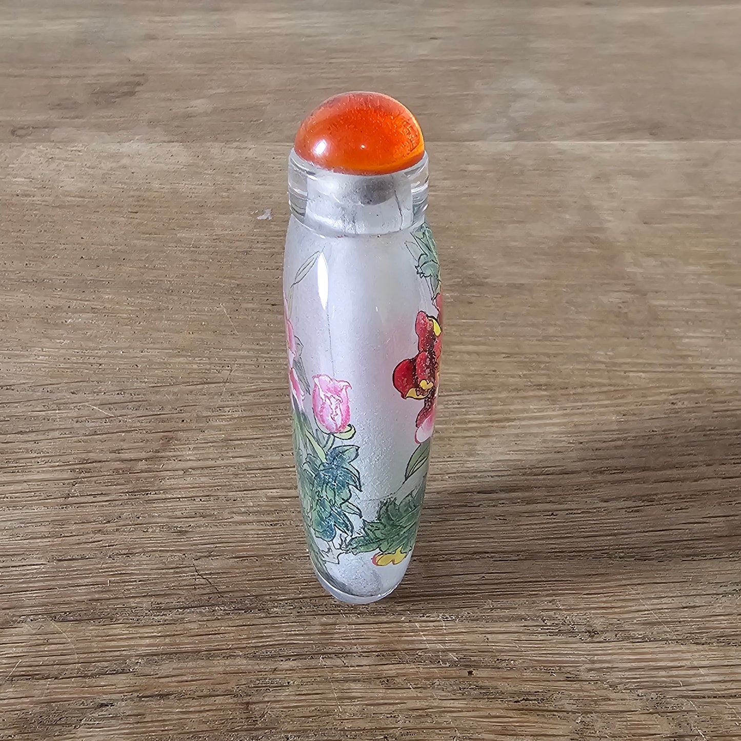 Vintage Chinese reverse painted Peonies glass snuff bottle with orange glass stopper