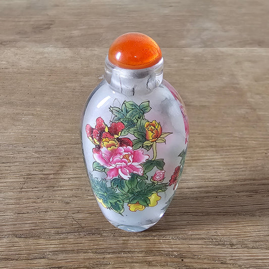 Vintage Chinese reverse painted Peonies glass snuff bottle with orange glass stopper