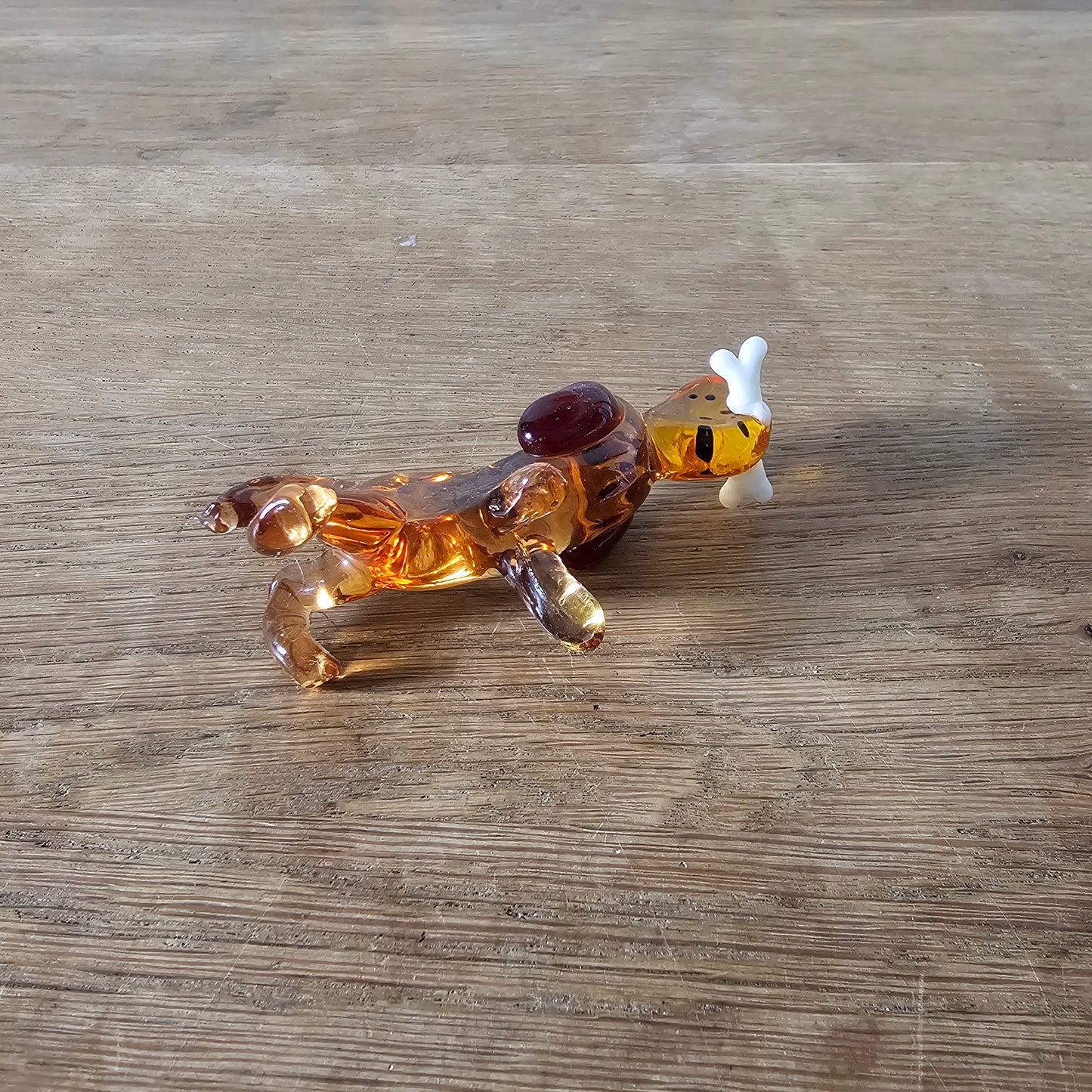 1970s Murano-style amber art glass daschund with bone figurine