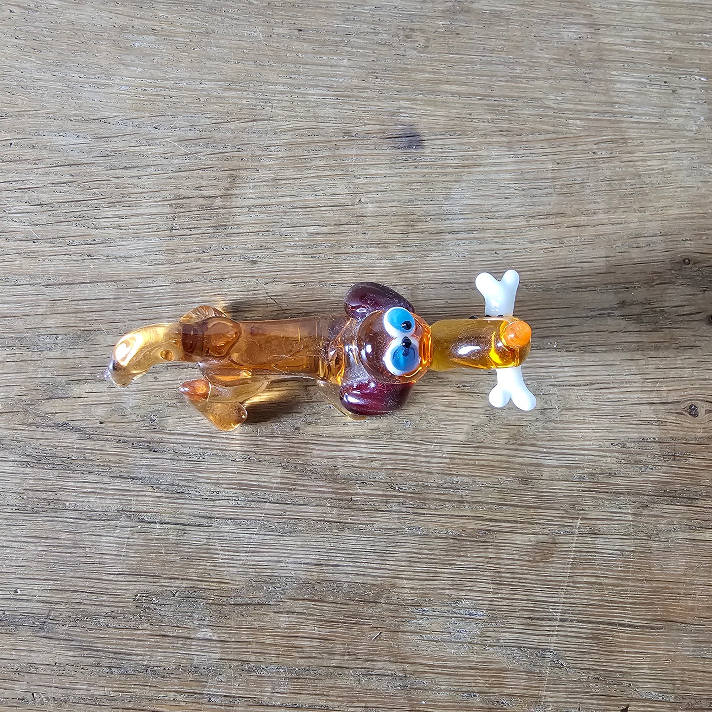 1970s Murano-style amber art glass daschund with bone figurine